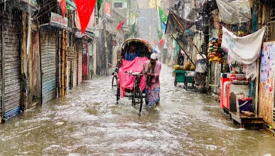 A man pulls a rickshaw on a waterlogged road amid rain in Wari, Dhaka, on Friday, July 12, 2024. Photo: Sk Sharifuddin Ahad/Dhaka Tribune