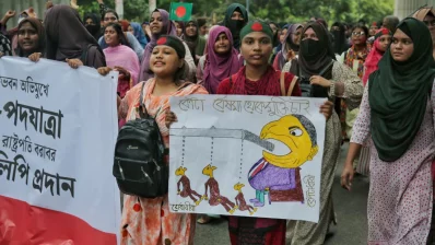 Students hold banners and posters at a march towards Bangabhaban on Sunday, July 14, 2024. Ahadul Karim Khan/Dhaka Tribune