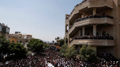 Druze elders and mourners during a mass funeral in the Druze town of Majdal Shams in the Israel-annexed Golan Heights, on July 28, 2024.  Photo: AFP