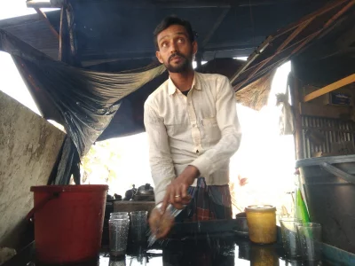 Liton Ali, father of Bangladesh national women&rsquo;s football team player Mosammat Sagorika, cleaning the tea cups