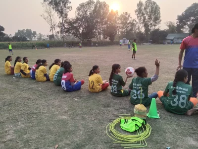 The young Jangaon women’s football academy players await instructions from their coach during a training session
