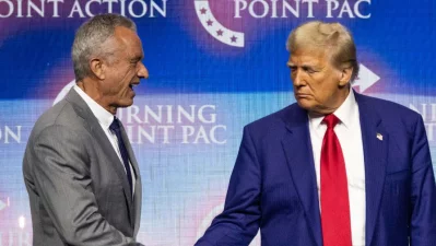 Donald Trump, right, shakes hands with US politician Robert F Kennedy Jr during a campaign rally at the Gas South Arena, in Duluth, Georgia on October 23, 2024. Photo: AFP