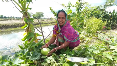 A woman growing watermelons on the banks of a rehabilitated canal. Photo: Center for Natural Resource Studies