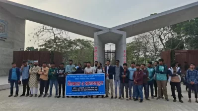 Students gathered in front of Begum Rokeya Universitys main gate, demanding the immediate correction of the date of Abu Sayeds death in the new edition of NCTB textbooks on Monday, January 6, 2025. Photo: Dhaka Tribune