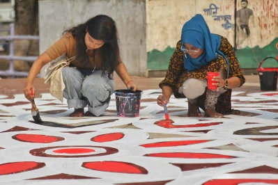 At the site, students of the Fine Arts department were painting intricate alpana motifs on the roads leading to the Shaheed Minar. Photo: Mehedi Hasan/Dhaka Tribune