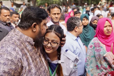 A father can be seen embracing his daughter before the SSC exams begin at Azimpur Government Girls` School and College on April 10, 2025. Photo: Ahadul Karim Khan/Dhaka Tribune