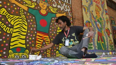 An artist is working on a traditional folk painting as part of preparations for Pohela Boishakh, the Bengali New Year celebrations. Photo: Mehedi Hasan/Dhaka Tribune