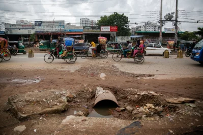 Broken roads filled with stagnant rainwater and scattered garbage near the traffic office contribute to the disorder, making daily movement difficult for both pedestrians and vehicles. Photo: Mehedi Hasan/Dhaka Tribune