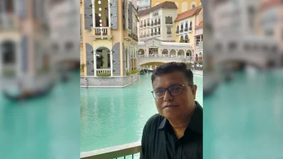 The writer standing in front of the Venice Grand Canal Mall, a major shopping and lifestyle destination in McKinley Hill, Taguig City, the Philippines.