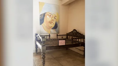 A wooden cot used by Nazrul, preserved inside the Nazrul Smriti Kendra