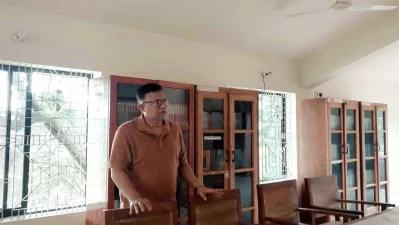 The writer standing inside the library on the first floor of Nazrul Smriti Kendra