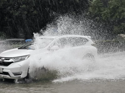 Vehicles move through waterlogged roads in Mirpur 10 after persistent monsoon rain inundated the area, slowing traffic and disrupting daily commuting in Dhaka on July 12, 2026. Photo: Dhaka Tribune