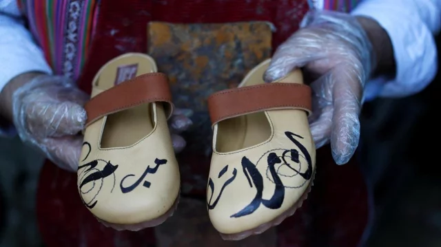 Indignant Palestinian shoemaker marks his wares with names of Trump and  Macron