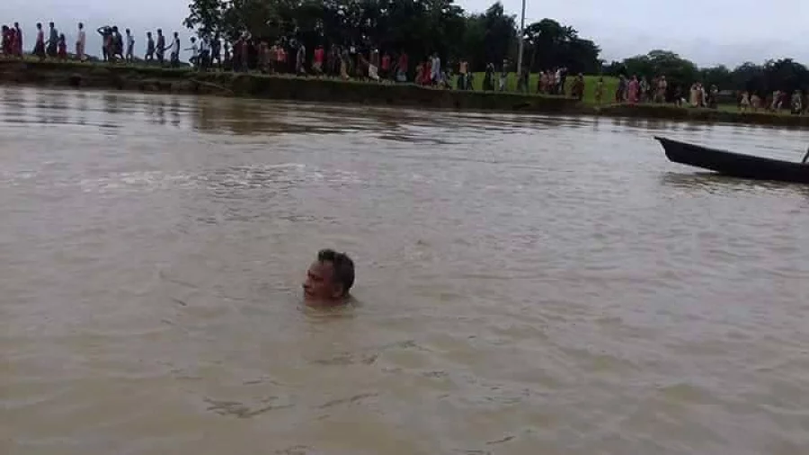 Khitindra Chandra Baishya in the midst of his successful 146km swim down the Kangha River on August 6, 2017 Dhaka Tribune