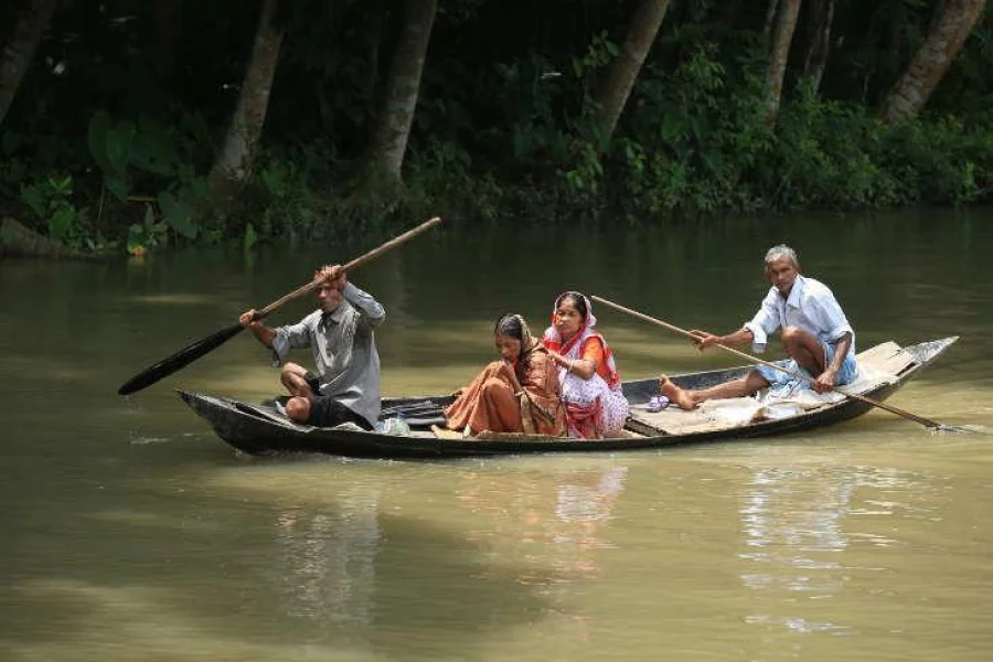 Two women travelling by a boat. Photo: Syed Zakir Hossain/Dhaka Tribune