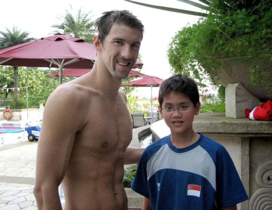 Singapore swimmer Joseph Schooling (R) poses with U.S. swimmer Michael Phelps during a training camp in Singapore in this 2008 photo released by the Schooling family August 13, 2016. May Schooling/Handout via REUTERS ATTENTION EDITORS - THIS PICTURE WAS PROVIDED BY A THIRD PARTY. EDITORIAL USE ONLY. NO RESALES. NO ARCHIVE.