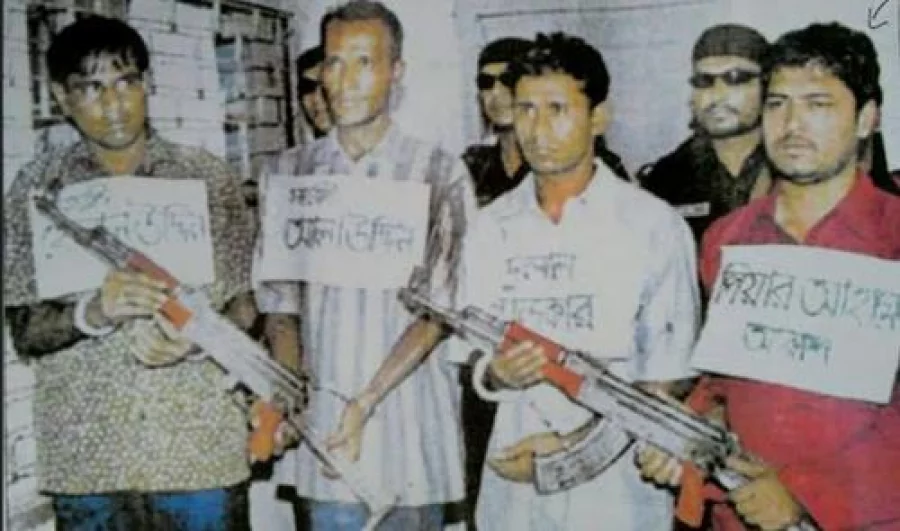 Peyar Ahmed Akash (red shirt) and three of his associates after their arrest in 2005