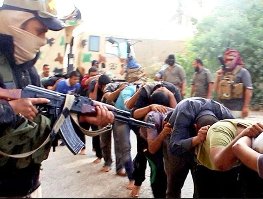 This image posted online by Islamic State militants on June 14, 2014 shows Iraqi cadets captured by IS moments before they were killed in Tikrit, Iraq. Their bodies are believed to be in one of the many mass graves left behind by Islamic State extremists AP