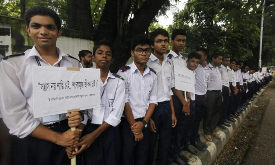Students of Engineering University School in BUET stand on the road protesting terrorism