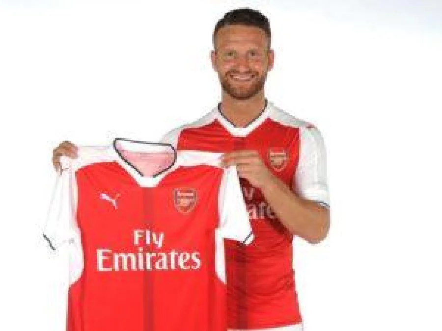 German international Shkodran Mustafi poses with his new Arsenal shirt Arsenal official website