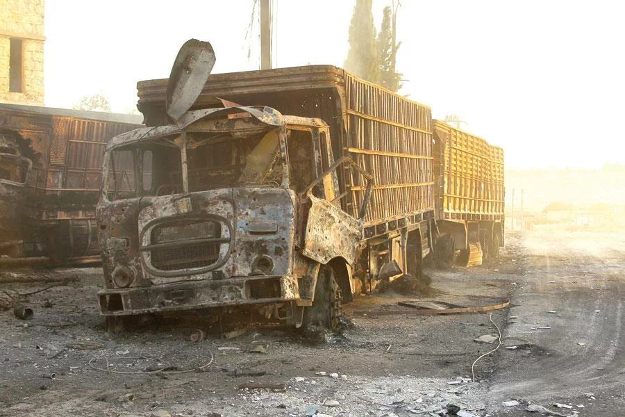 Damaged aid trucks are pictured after an airstrike on Urm al-Kubra town, western Aleppo city on September 20 REUTERS