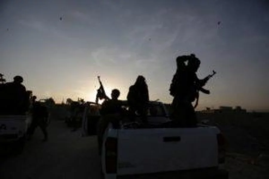 Rebel fighters shoot their weapons celebrating what they said was the taking over of Baraghedeh and Kafr-Ghan towns, in the northern Aleppo countryside. REUTERS/Khalil Ashawi