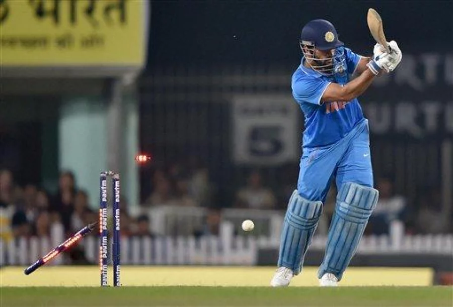 Ranchi :  The bails fly off the wicket resulting in the dismissal of India's Mahendra Singh Dhoni, bowled out by New Zealand's James Neesham during the fourth one-day international cricket match in Ranchi on Wednesday. PTI Photo by Swapan Mahapatra(PTI10_26_2016_000310B)