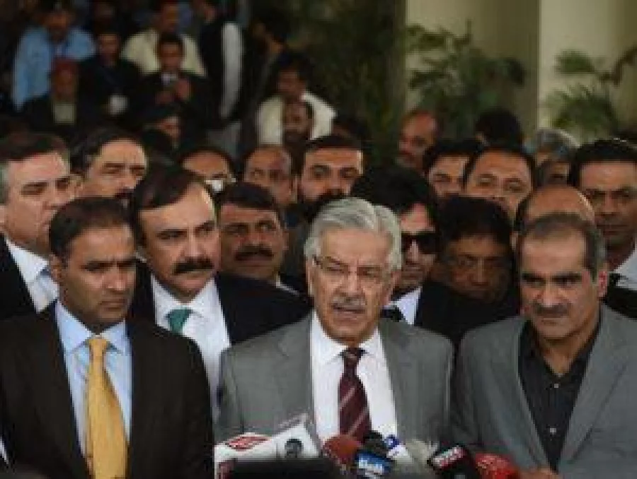 Pakistan Defence Minister Khawaja Muhammad Asif (C) speaks to media after leaving the Supreme Court building during a break in the case hearing over the Panama Papers in Islamabad on November 1, 2016. Amnesty International has called on Pakistan to release hundreds of opposition activists detained before a planned mass protest, as police used tear gas and rubber bullets overnight to prevent demonstrators from entering Islamabad. Prime Minister Nawaz Sharif is under growing pressure from opposition parties, mainly Imran Khan's Pakistan Tehreek-i-Insaf (PTI). It plans to lock down the capital November 2 as it calls for him to resign over his children's offshore bank accounts,revealed in the Panama Papers leak. The planned protest comes at a sensitive time for Sharif, with the Supreme Court hearing a case about the Panama Papers revelations from November 1. / AFP PHOTO / FAROOQ NAEEM
