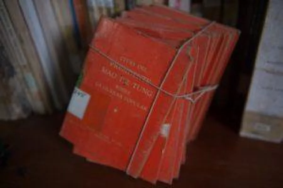Books on Chinese communist revolutionary Mao Tse-Tung that belonged to the terrorist group Sendero Luminoso (Shining Path), are seen in the small museum at the anti-terrorist direction Dircote dedicated to the group's leader Abimael Guzman, in Lima, on October 27, 2016. A modest police museum keeps hundreds of personal belongings of the historical leader of the Maoist group Sendero Luminoso, Abimael Guzman, to show the threat posed by this fundamentalist guerrilla to Peru. / AFP PHOTO / Ernesto BENAVIDES
