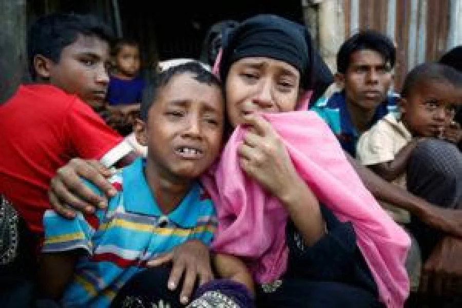 A Rohingya Muslim woman and her son cry after being caught by Border Guard Bangladesh (BGB) while illegally crossing at a border check point in Cox’s Bazar , Bangladesh, November 21, 2016. REUTERS