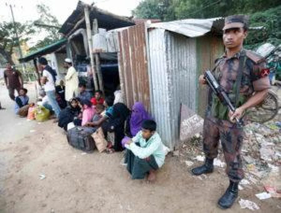 A security personnel stands guard after catching thirty eight Rohingya Muslims illegally crossing at a border check point in Cox’s Bazar, Bangladesh, November 21, 2016. REUTERS
