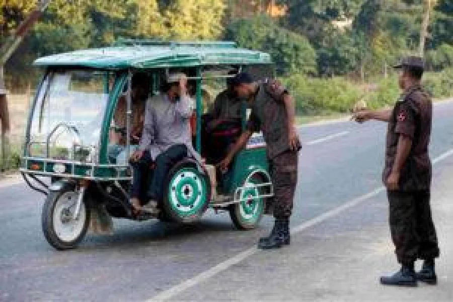 Security personnel check an auto-rickshaw near a check post to identify Rohingya refugee in Cox’s Bazar, Bangladesh, November 21, 2016. REUTERS