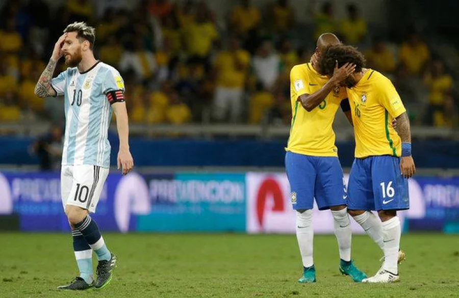 Football Soccer - Brazil v Argentina - World Cup 2018 Qualifiers - Mineirao stadium, Belo Horizonte, Brazil - 10/11/16 - Argentina's Lionel Messi (10) reacts next to Brazil's Fernandinho and Marcelo (R). REUTERS/Cristiane Mattos FOR EDITORIAL USE ONLY. NO RESALES. NO ARCHIVES