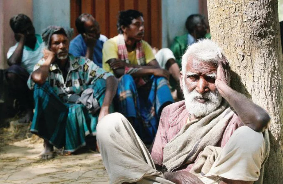 Elderly Santal men sit in despair after they were attacked and evicted from their homes on November 6, 2016 Mehedi Hasan/Dhaka Tribune