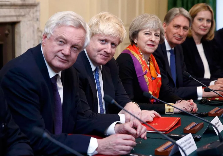 Britain's Prime Minister Theresa May, 3rd from left, and left to right, David Davies Secretary of State for Exiting the European Union, Foreign Secretary Boris Johnson, May, Chancellor of the Exchequer Philip Hammond and Home Secretary Amber Rudd sit opposite a Polish delegation during an intergovernmental consultation meeting in the Cabinet Room in 10 Downing Street in central London, Britain November 28, 2016 Reuters