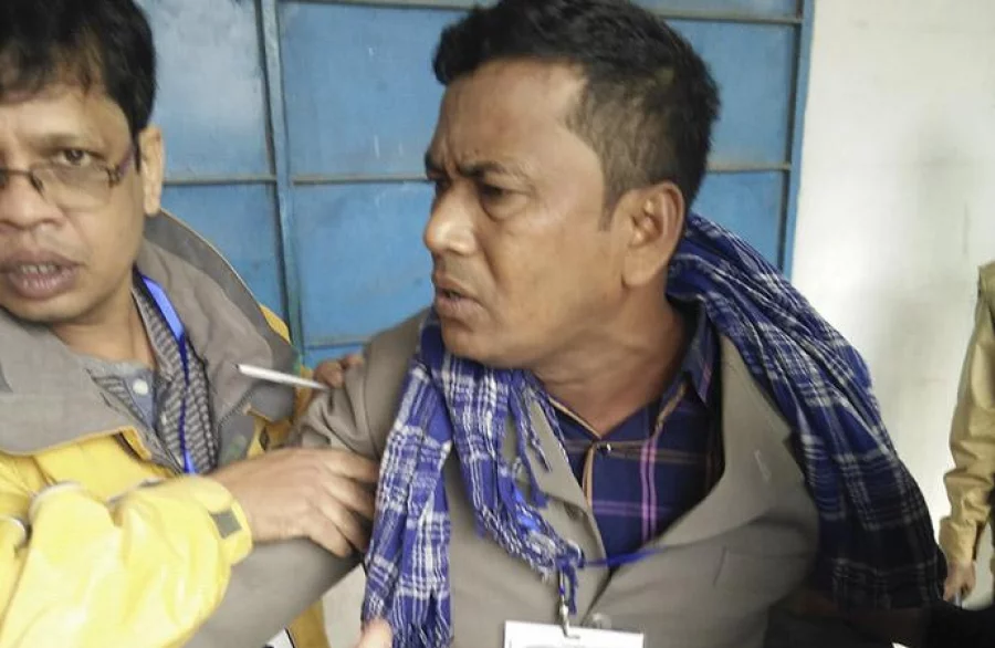 Police detains man for casting fake vote. Photo: Nure Alam Durjoy