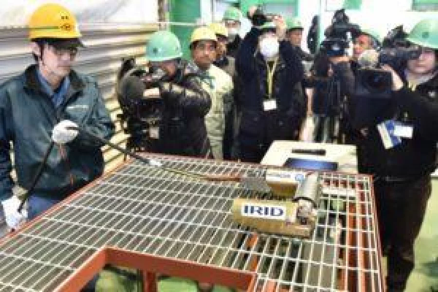 A reactor probe robot PMORPH, with five cameras and a radiation dosimeter developed by Hitachi-GE Nuclear Energy and the International Research Institute for Nuclear Decommissioning (IRID), is unveiled at a press preview in Hitachi, Ibaraki prefecture on February 3, 2017.  The robot will be remotely operated as it is inserted into the reactor at the Tokyo Electric Power Fukushima Daiichi Nuclear Power Station Unit 1. to examine the state of fuel melted from the core. / AFP PHOTO / Kazuhiro NOGI