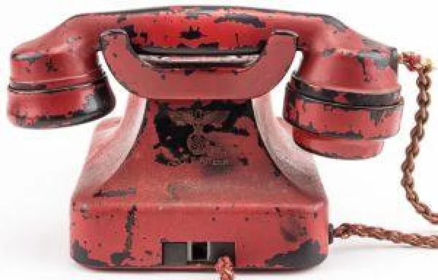 This undated image obtained from Alexander Historical Auctions shows a phone belonging to Nazi leader Adolf Hitler which will be auctioned by Alexander Historical Auctions in Chesapeake City, Maryland, on February 19, 2017 The phone, which the Fuehrer used to dictate many of his deadly World War II commands, sold at auction on February 19 for $243,000, the US house selling it announced. Originally a black Bakelite phone, later painted crimson and engraved with Hitler's name, the relic was found in the Nazi leader's Berlin bunker in 1945 following the regime's defeat.   / AFP PHOTO / Alexander Historical Auctions / HO / RESTRICTED TO EDITORIAL USE - MANDATORY CREDIT "AFP PHOTO / Alexander Historical Auctions" - NO MARKETING NO ADVERTISING CAMPAIGNS - DISTRIBUTED AS A SERVICE TO CLIENTS
