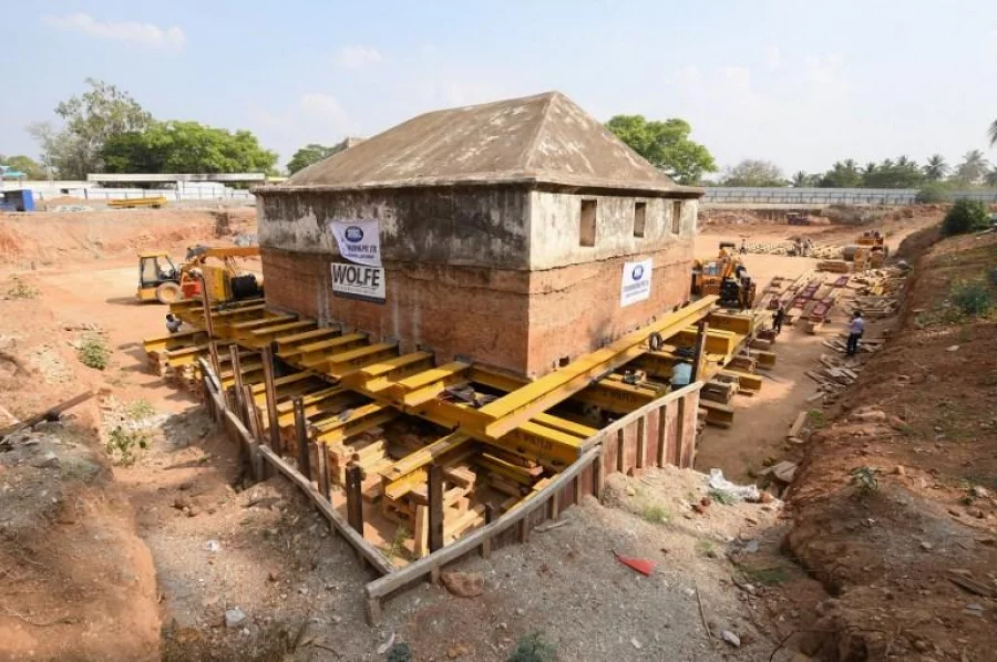 This photo taken on March 9, 2017 shows the historic Tipu Sultan's armoury being moved by workers at Srirangapatna near Mysore, in the Indian state of Karnataka. Dozens of workers are using cranes and jacks to shove and push a 1,000-tonne, 18th century armoury to make way for a new rail track in a southern Indian state. The armoury was one of the ten structures built to store gunpowder and weapons by warrior king Tipu Sultan who ruled the kingdom of Mysore between 1782 and 1799.  / AFP PHOTO / -