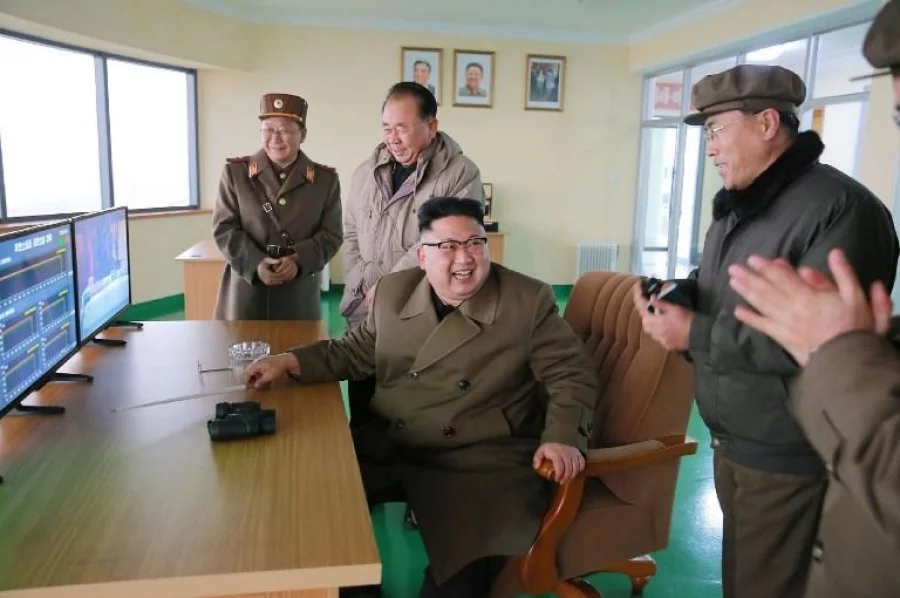This undated picture released by North Korea's official Korean Central News Agency (KCNA) on March 19, 2017 shows North Korean leader Kim Jong-Un, centre, inspecting the ground jet test of a newly developed high-thrust engine at the Sohae Satellite Launching Ground in North Korea AFP 