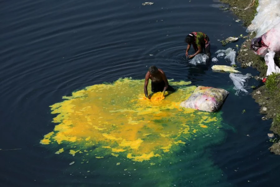 People's are washing chemical bags (toxic) and polluting Turag River on 19 February 2014. Photo was taken from Tongi area