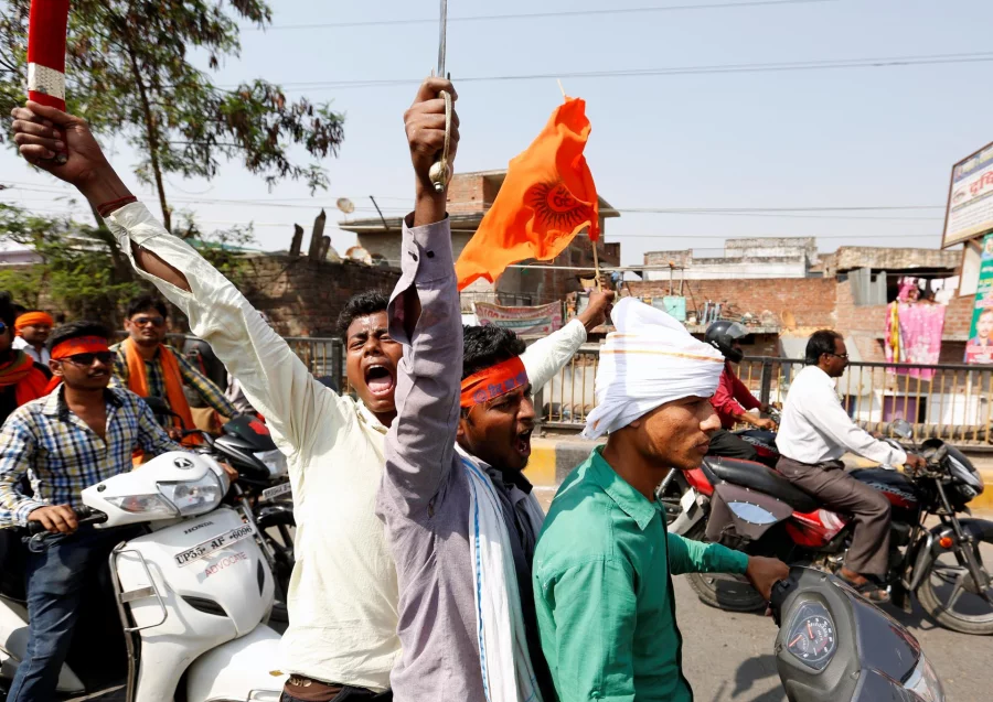 Hindu Yuva Vahini vigilante members take part in a rally in the city of Unnao, India, April 5, 2017. Picture taken April 5, 2017. REUTERS/Cathal McNaughton    To Match Insight INDIA-POLITICS/RELIGION