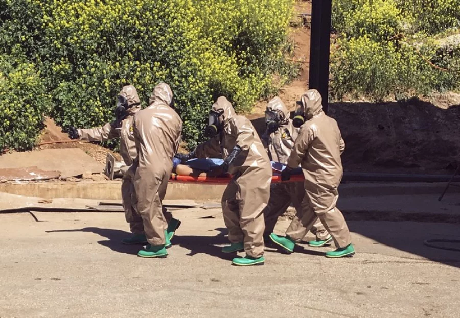 In this photo taken on Tuesday, April 4, 2017 and made available Wednesday, April 5, Turkish experts carry a victim of alleged chemical weapons attacks in Syrian city of Idlib, at a local hospital in Reyhanli, Hatay, Turkey. A suspected chemical attack in a town in Syria's rebel-held northern Idlib province killed dozens of people on Tuesday, opposition activists said, describing the attack as among the worst in the country's six-year civil war.(AP Photo)