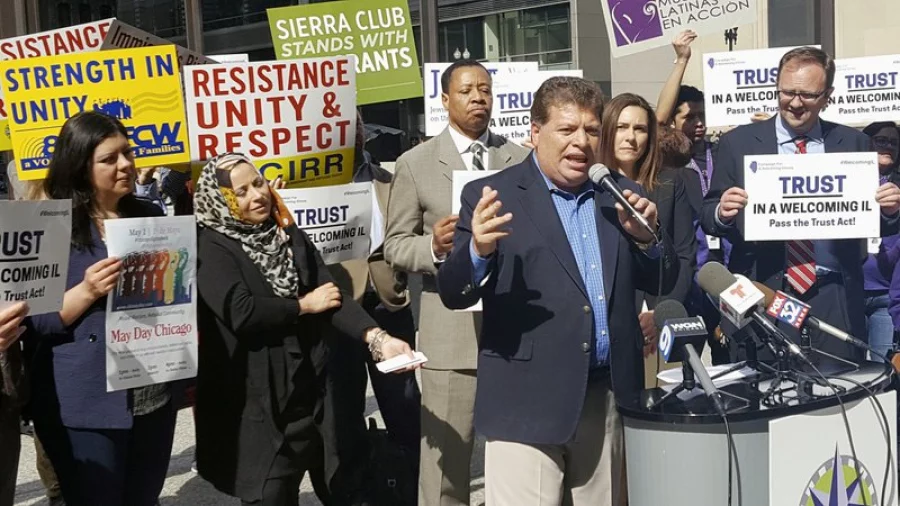 In this April 24, 2017, photo Artemio Arreola, an organizer with the Illinois Coalition for Immigrant and Refugee Rights, speaks to other advocates in downtown Chicago. The advocates plan to march in a May 1 rally in Chicago. (AP Photo by Sophia Tareen) 