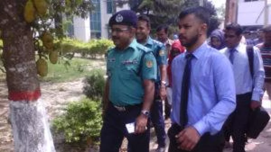Rajshahi Metropolitan Police officials escort two Maldivian police officials to speak with students and officials of Rajshahi Islami Bank Medical College on April 4, 2017 Abdullah Al Dulal/Dhaka Tribune