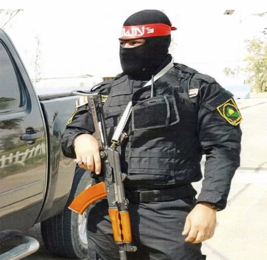 This undated photo obtained by the Associated Press shows an Iraqi bodyguard hired by Sallyport Global to protect VIPs. When a Toyota SUV was stolen from Balad air base, he became the chief suspect and was linked to a dangerous Iran-backed militia and was viewed by investigators as “a hard-core recruit to become a terrorist who poses a serious threat to all personnel on this base.” (Photo via AP) 