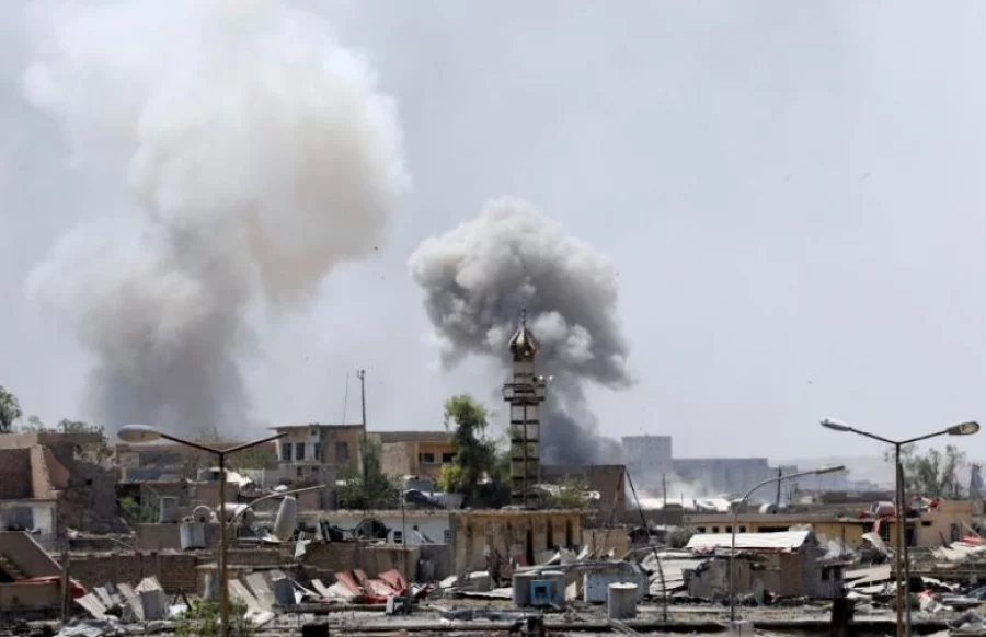 Smoke billows from the Islamic State militants positions after an artillery attack by Iraqi forces. REUTERS/Erik De Castro