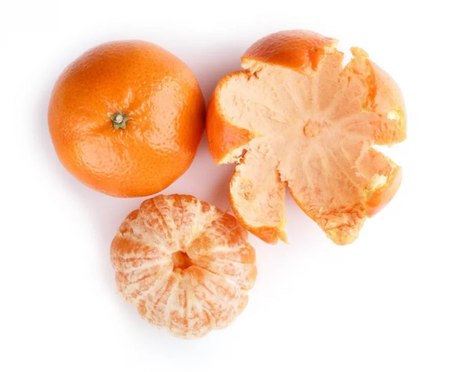 Ripe mandarin close-up on a white background. Tangerine orange. Colorful Food and drink still life concept. Fresh fruits and vegetables on color background. Clementine. Citrus. Fresh fruits. Diet.