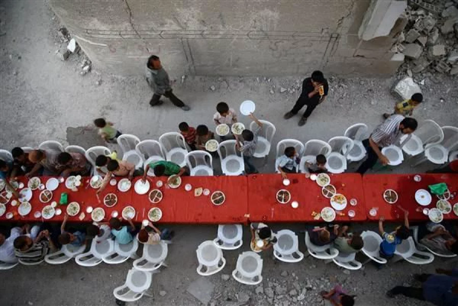 Residents break their fast in Douma on June 18 REUTERS