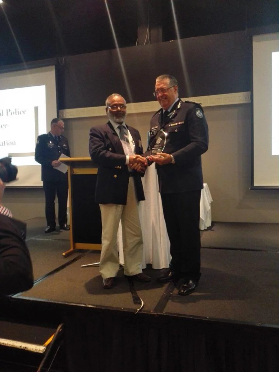 Queensland Commissioner of Police Ian Stewart presents Bangladeshi origin community leader Dr Shahjahan Khan with an award for promoting peace on Monday, June 5, 2017 Collected